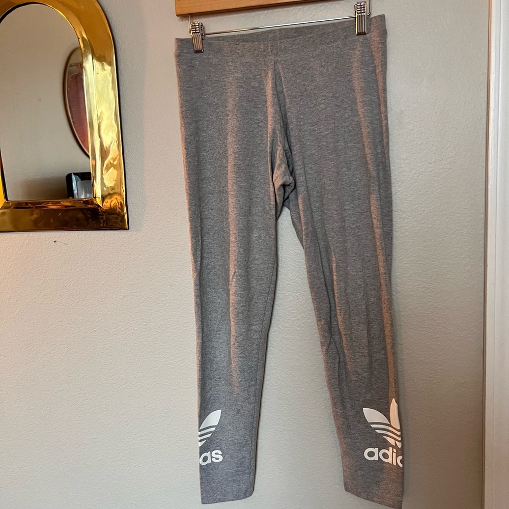 Heather grey adidas leggings with white adidas logo on both legs